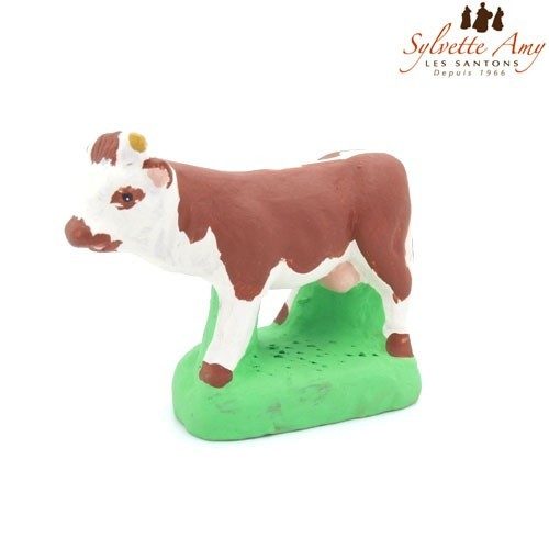 La vache marron et blanche